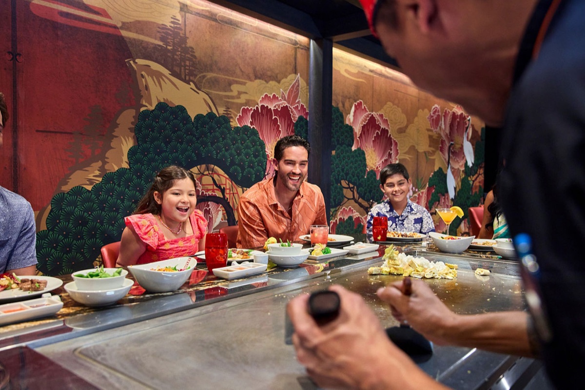 Family enjoying the hibachi experience at Izumi