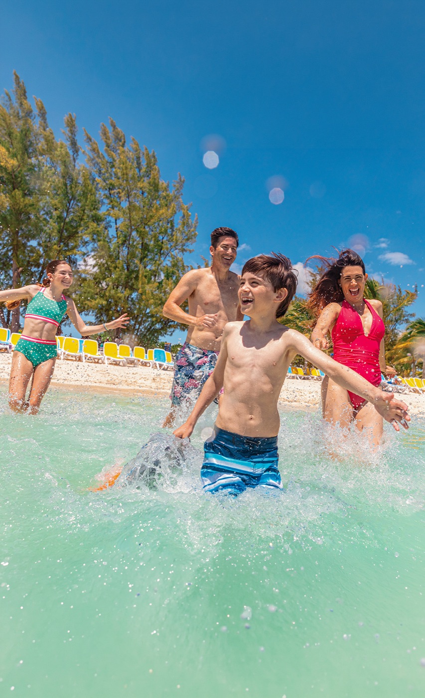 Family playing in the sea in the Caribbean